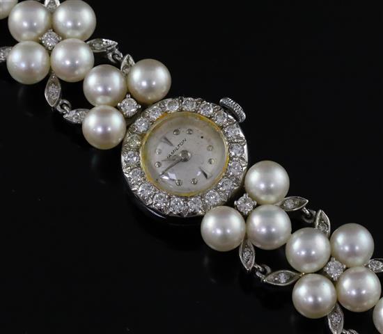 A ladys platinum, iridium, diamond and cultured pearl set Hamilton manual wind cocktail watch, approx. 17.5cm.